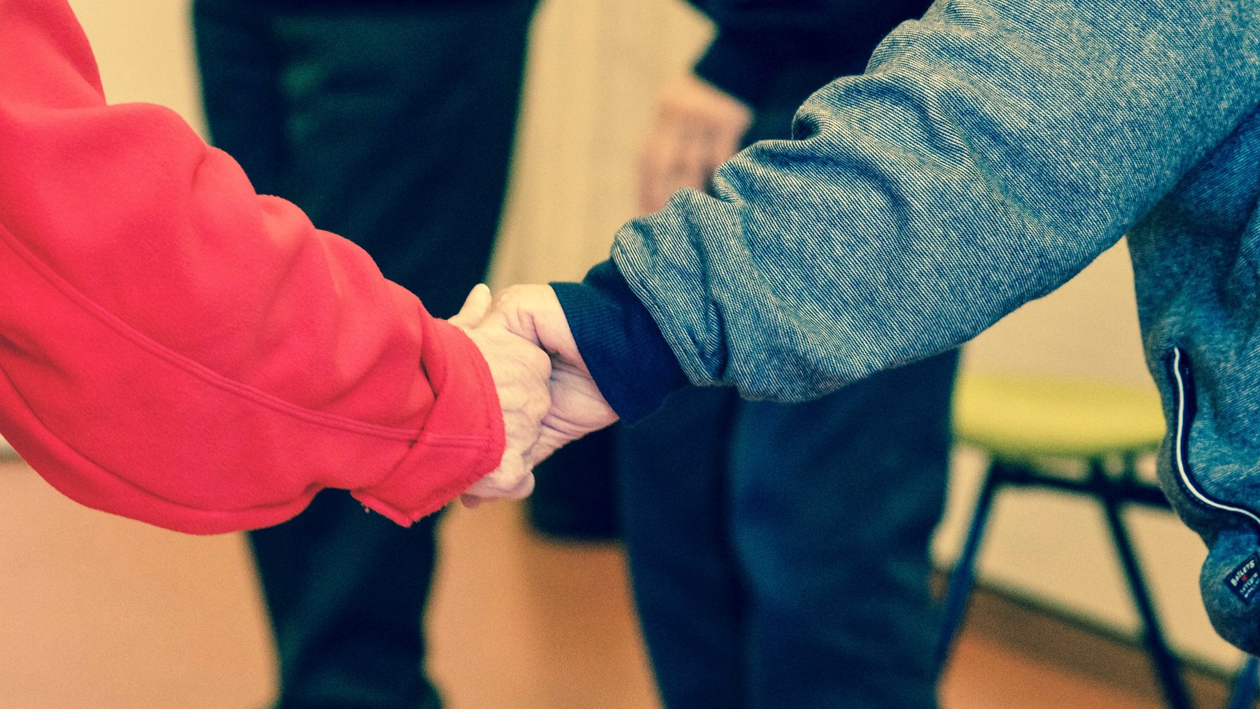 Family members holding hands together